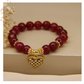 Pulsera Jade Rojo 10mm & dije de corazón con corazones mini en zirconitas