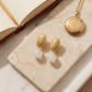 Aretes de Cuarzo Rosa Facetado con Base Ovalada Dorada