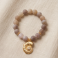 Pulsera Agata Drusy con dije de caracola dorada y zirconias