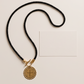 Collar de Cordón Negro con Medalla Dorada de San Benito