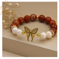 Pulsera Jaspe Rojo 12mm y perla blanca & enlace de mariposa con zirconias y baño en oro