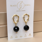 Aretes de Ónix Negro Facetado con Base Ovalada con Dos Zirconias